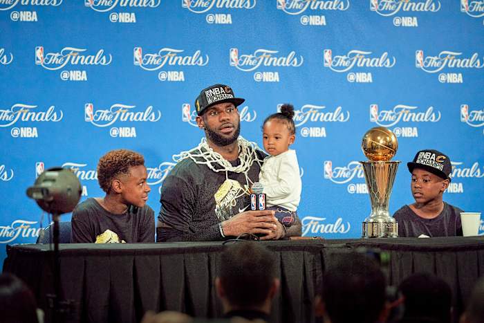 By the time James won a title with the Cavs, in 2016, ESPN had already reported that Duke had offered Bronny (left, with Zhuri and Bryce) a scholarship.